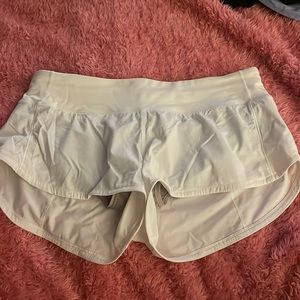lululemon athletic shorts, comfy, a little low rise, white, with pockets notused